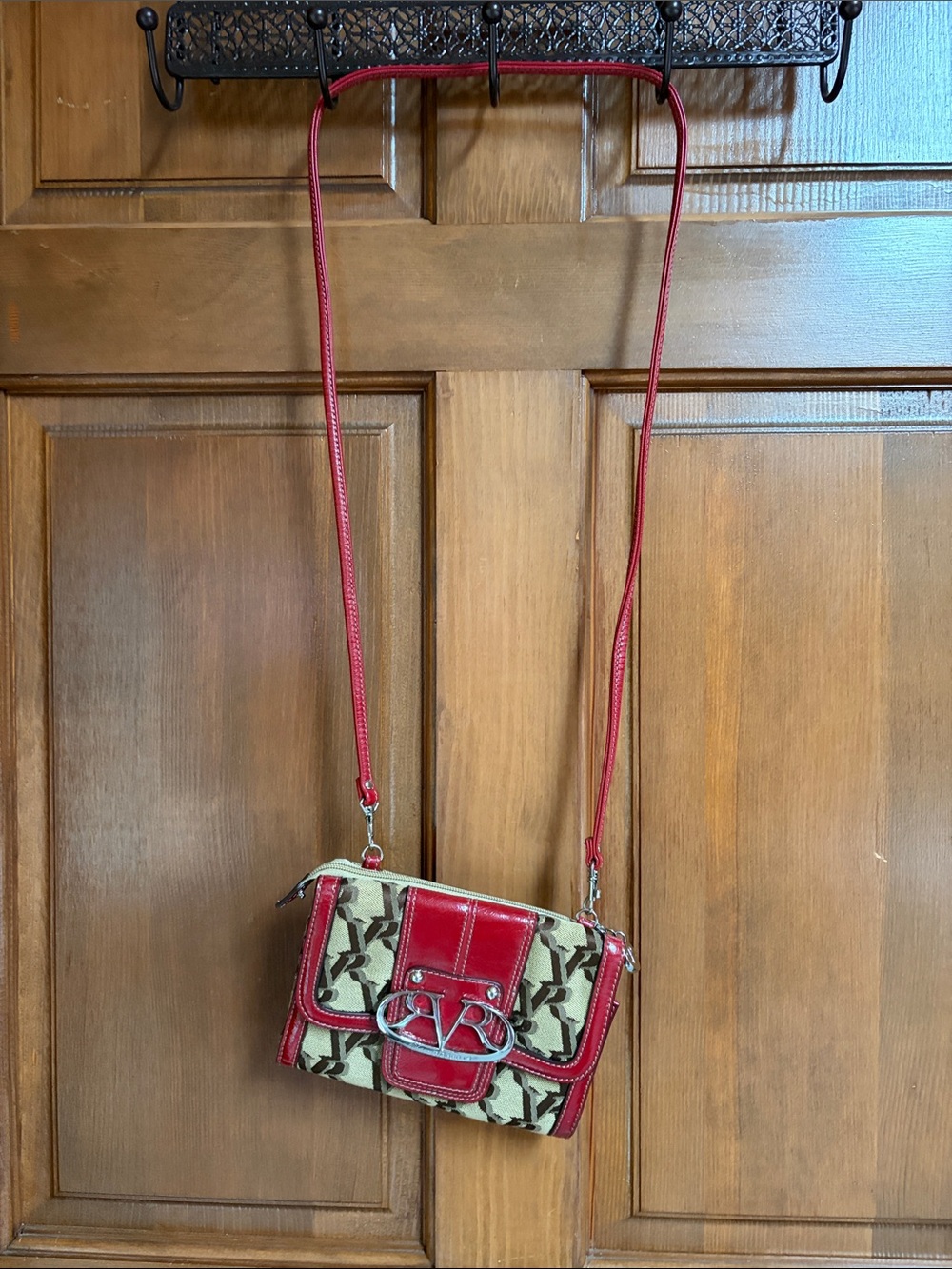 Victoria Robert’s Signature Pattern Red Crossbody Bag with Silver Logo Accent